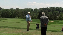 Mike M., walking across the driving range tee.